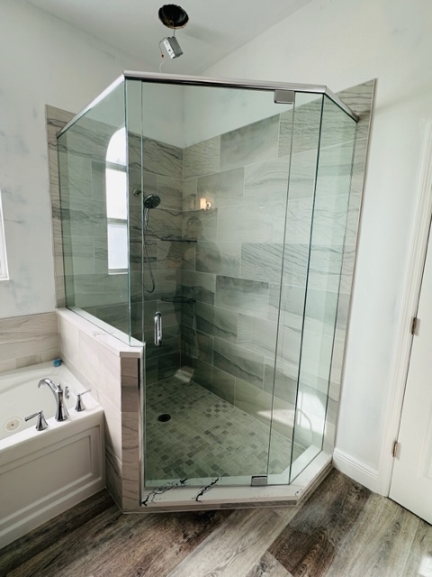 A Shower Unit With Glass Panel Walls