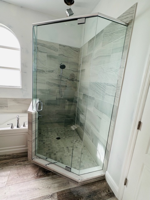 A Shower Unit With Glass Panels