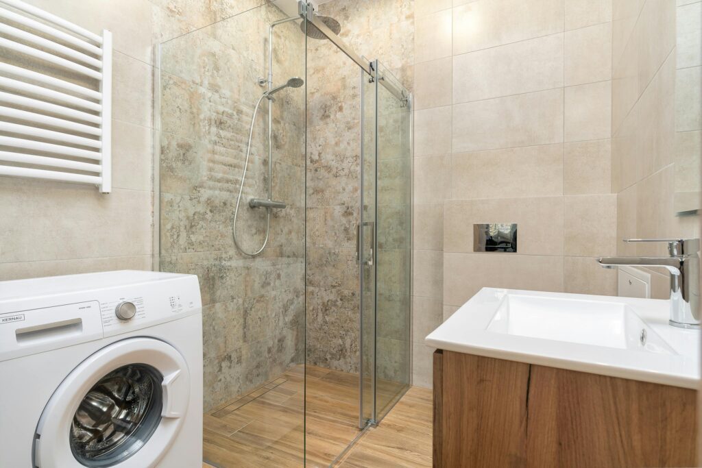 Water damage around shower pan in bathroom